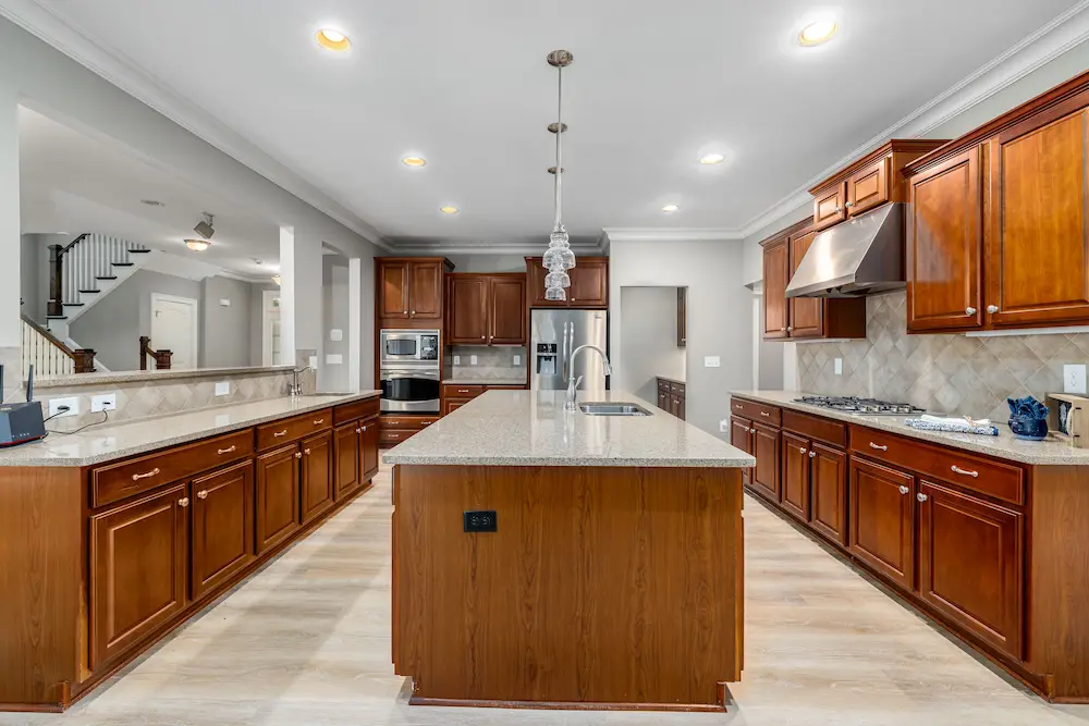 Two-tone custom kitchen renovation in Scarsdale NY with quartzite island countertop