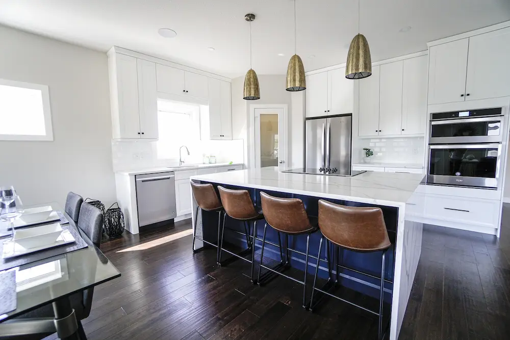 Integrated kitchen appliances with hidden refrigerator design